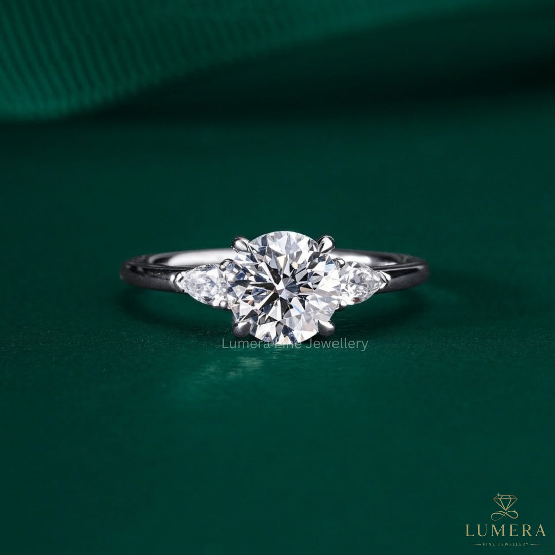 1.00 CT Round Diamond Three-Stone Ring with Pear Side Stones