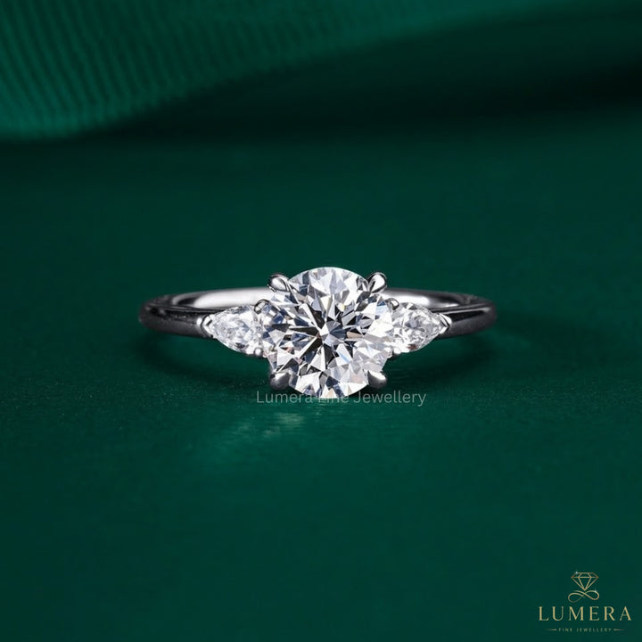 1.00 CT Round Diamond Three-Stone Ring with Pear Side Stones