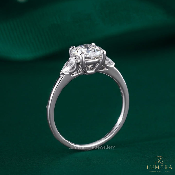 1.00 CT Round Diamond Three-Stone Ring with Pear Side Stones